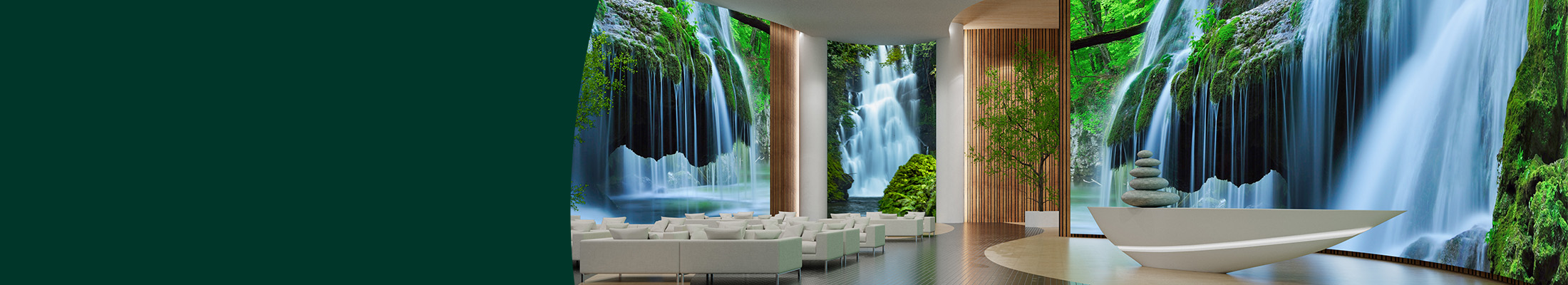 A large foyer space with floor to ceiling LED videowalls showing waterfalls